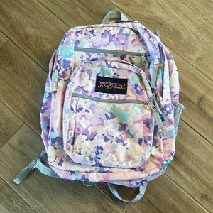 JanSport's Cross Town backpack. The polyester material keeps it durable.